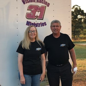 woman and man standing near trailer